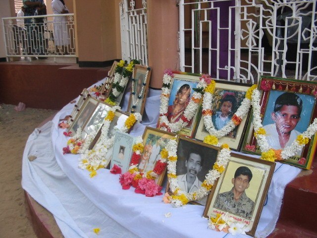 Portraits of victims displayed at a later commemoration of the Navaly church bombing.