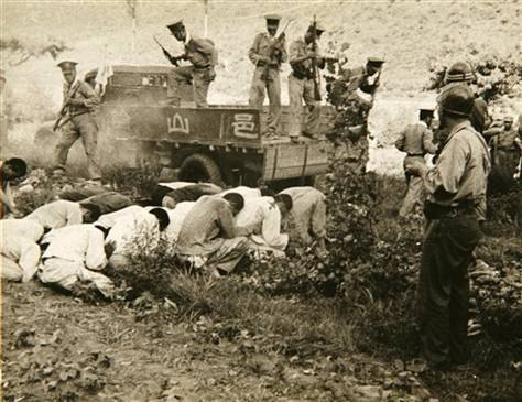 South Korean political prisoners being executed at Daejeon in July 1950; photograph taken by the US Army.