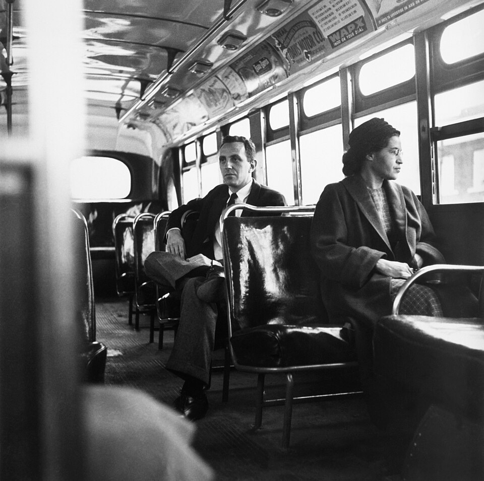 Rosa Parks on an integrated Montgomery bus in December 1956, after the boycott; not a photograph of her arrest.