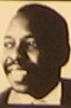 A reproduced portrait of Ken Saro-Wiwa from a BBC African Icons poster photographed in the African Studies Centre Leiden library.