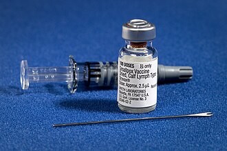 A smallpox vaccination kit with vaccine vial and bifurcated needle.