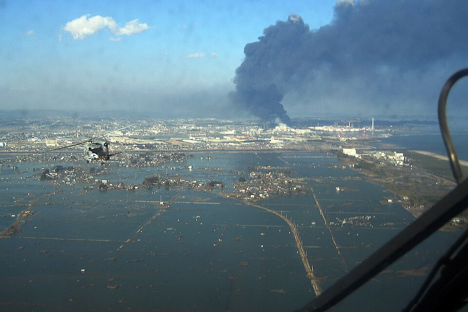 Damage around Sendai's port during the 2011 earthquake and tsunami relief response.